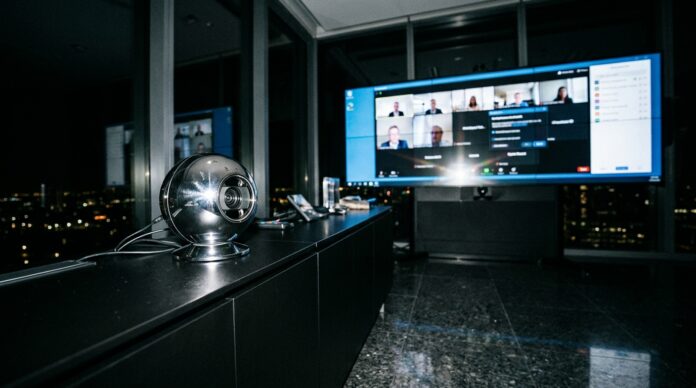 2026-10-22_agent_60d95edf-d6e7-4d22-b3df-869467975092_1792642528614 Spherical biometric device in a conference room with screens in the background (AI-generated image)